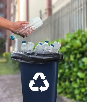 bigstock-Man-Hand-Putting-Plastic-Reuse-210479944